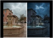Post traitement d'une photo prise un jour de pluie dans le c?ur ancien d'une ville de la Drôme. Objectif recherché : donner un ton plus sombre, à la tombée de la nuit et mettre en valeur la fontaine et son eau.